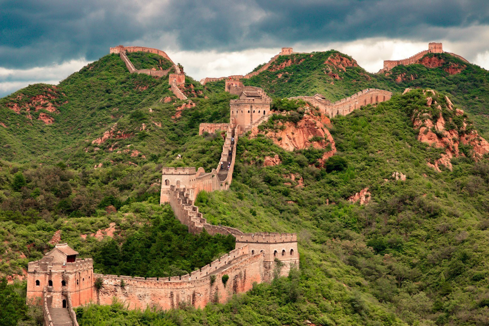 Great Wall winding over green mountains