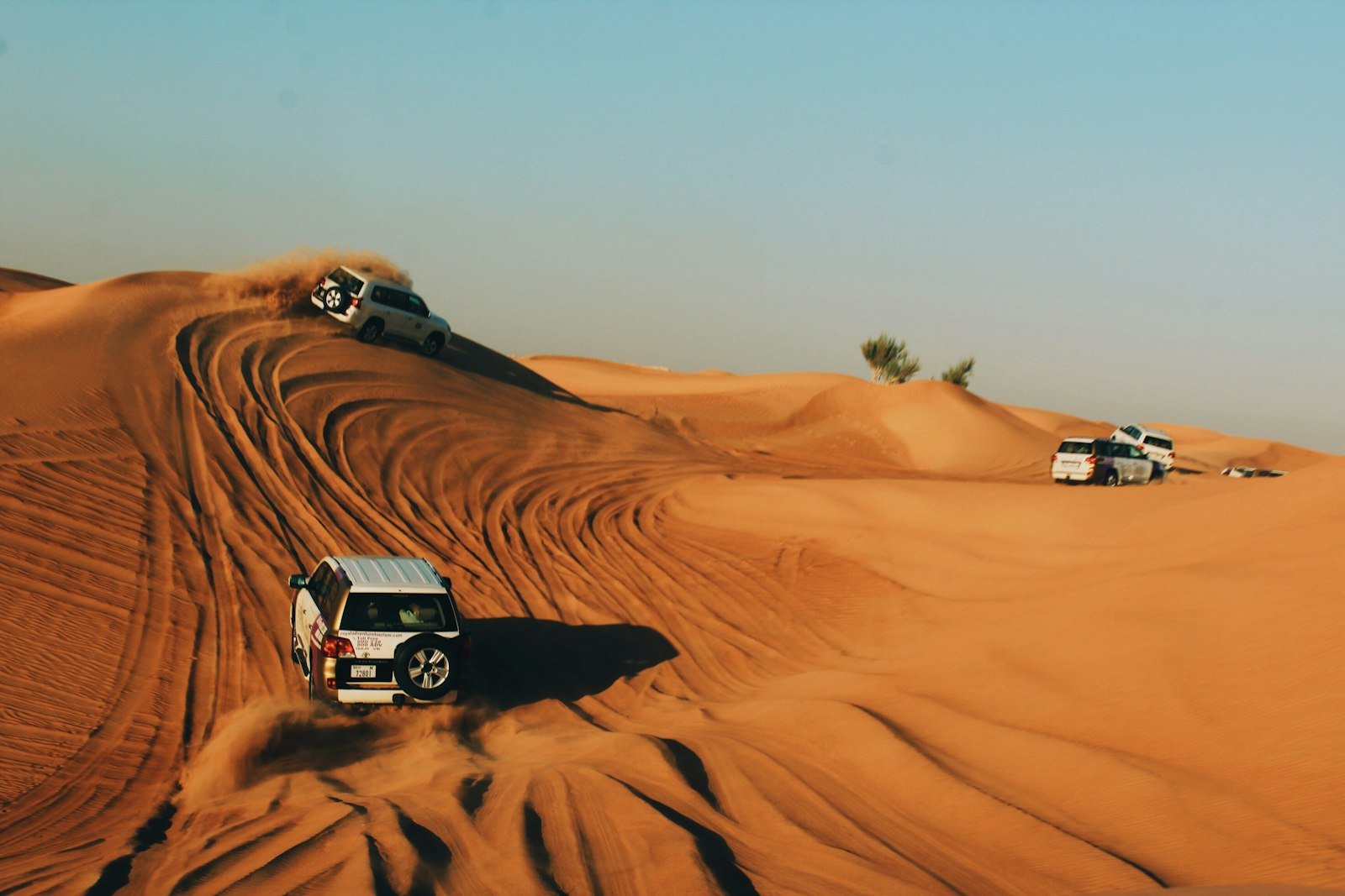 Desert safari vehicles on the dunes
